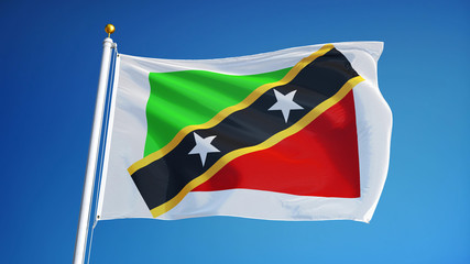 Saint Kitts and Nevis flag waving against clean blue sky, close up, isolated with clipping path mask alpha channel transparency