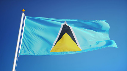 Saint Lucia flag waving against clean blue sky, close up, isolated with clipping path mask alpha channel transparency