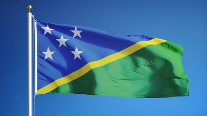 Solomon Islands flag waving against clean blue sky, close up, isolated with clipping path mask alpha channel transparency