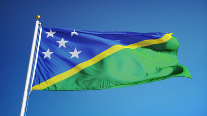 Solomon Islands flag waving against clean blue sky, close up, isolated with clipping path mask alpha channel transparency