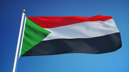 Fototapeta na wymiar Sudan flag waving against clean blue sky, close up, isolated with clipping path mask alpha channel transparency