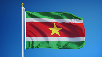 Suriname flag waving against clean blue sky, close up, isolated with clipping path mask alpha channel transparency