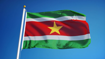 Suriname flag waving against clean blue sky, close up, isolated with clipping path mask alpha channel transparency
