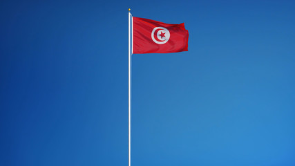 Tunisia flag waving against clean blue sky, long shot, isolated with clipping path mask alpha channel transparency