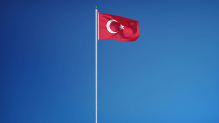 Turkey flag waving against clean blue sky, long shot, isolated with clipping path mask alpha channel transparency