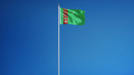 Turkmenistan flag waving against clean blue sky, long shot, isolated with clipping path mask alpha channel transparency