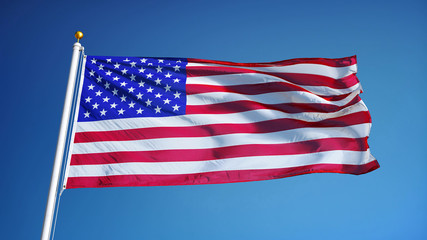 USA flag waving against clean blue sky, close up, isolated with clipping path mask alpha channel transparency