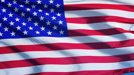 Fototapeta premium USA flag waving against clean blue sky, close up, isolated with clipping path mask alpha channel transparency