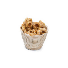 Pork rind in bamboo basket isolated on white