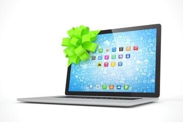 Tied laptop with green bow on white background. Modern present or gift for birthday, holiday, christmas. 3D rendering.