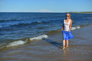 Fototapeta na wymiar Young woman on beach