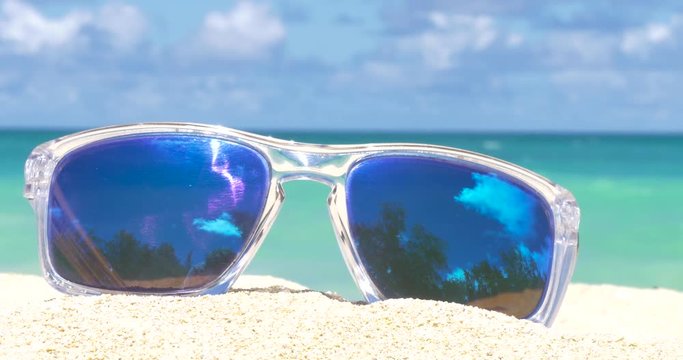 Vacation Travel Concept sunglasses on the sandy beach