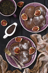 Fototapeta na wymiar Chocolate pancakes with chocolate sauce and figs 