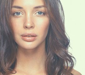 Fototapeta premium Close up portrait of beautiful young woman face. Isolated on white background.