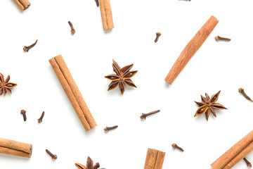 Set of cinnamon, clove and star anise, scattered in a chaotic manner, isolated on white background