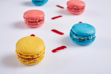 yellow, red and blue on a white background macaroon