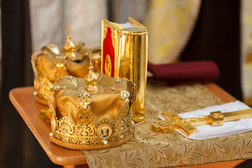 Fototapeta na wymiar Golden crowns for wedding ceremony in the Orthodox Church.