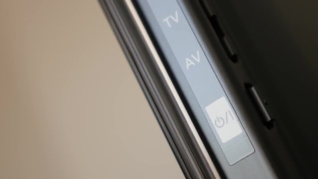 Contemporary LED or plasma TV powering ON on back button 4K 3840X2160 UltraHD footage - Flat screen device turning OFF or ON close-up 4K 2160p 30fps UHD video 