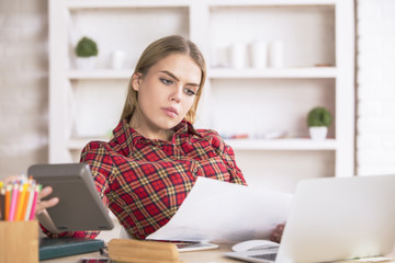 Young female accountant at work