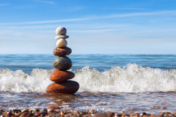 Concept of harmony and balance. Rock Zen near the sea