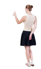 Back view of successful woman thumbs up. Rear view people collection. backside view of person. Isolated over white background. slender blonde in a dress shows hitchhiking