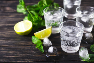 Cocktail with soda water, ice, lime and mint