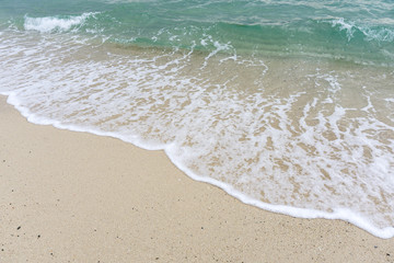 Fototapeta na wymiar Sea waves on a white sandy beach