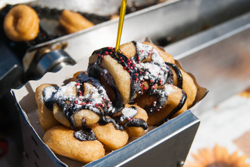 Mini donuts with chocolate, sprinkles and sugar