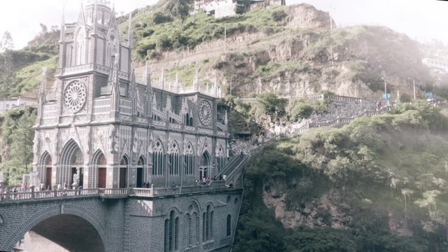LAS LAJAS, COLOMBIA - CIRCA SEPTEMBER 2015: People visiting the majestic Sanctuary builded over a canyon during the anniversary of the virgin of las lajas. 4k