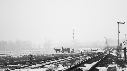 Old, rural railroads and railway station in winter time