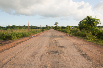 Damaged asphalt pavement road with potholes ,Asia