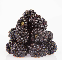 Blackberries: a stack of fruit on white background