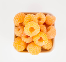 Raspberries: a bowl of fruit on white background