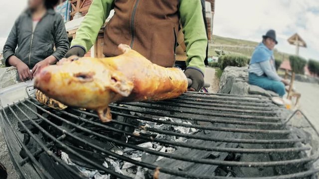 Cooking on the grill the traditional plate of the Andes the guinea pig