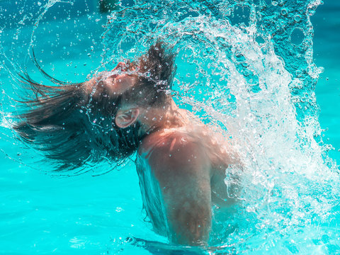 Young Man Splashing Water