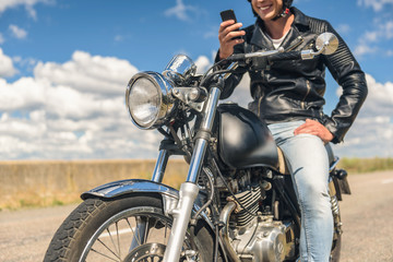 Obraz na płótnie Canvas Young man sitting on his motorbike