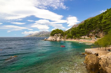 Naklejka premium small intimate rocky beach and beautiful blue sea