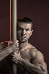 Fototapeta na wymiar Muscular man with crossbar
