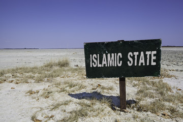 View of Islamic State signboard on desert
