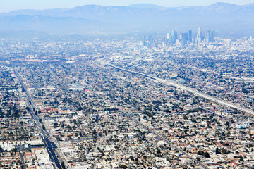 Aerial view of Los Angeles in the United States. City landscape with a mountain peak and downtown.