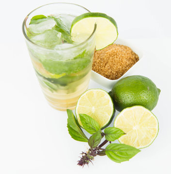 Mojito in a glass and ingredients on a white background