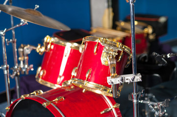 The red drum set inside studio.