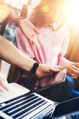 Fototapeta premium Young Coworkers Group Analyze Meeting Report Process.Business Woman Virtual Startup Marketing Project.Creative People Making Great Work Decisions Modern Office.Tablet Screen.Closeup Blurred Background