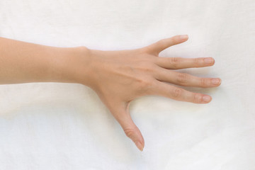 Female hand on a white background