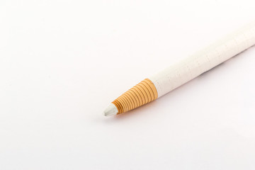 One white pencil isolated on white background
