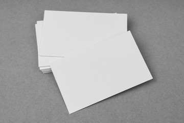 Business cards on gray background .