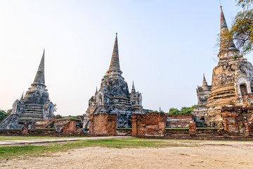 Fototapeta premium Ruins of ancient architecture three pagoda of Wat Phra Si Sanphet old temple famous attractions at Phra Nakhon Si Ayutthaya Historical Park in Ayutthaya Province, Thailand