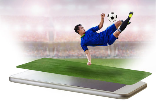 football player shooting the soccer ball on smart phone concept