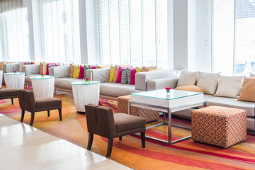 Closeup of modern furniture with pillows .