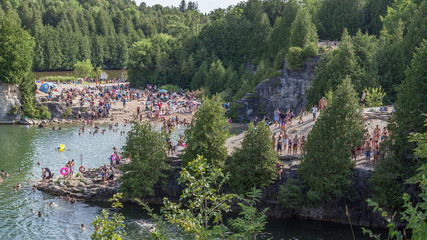 People swimming in Elora Quarry conservation area, Ontario, Canada 
This two acre former limestone...